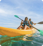 A couple having a ride in kayak in Isla Mujeres